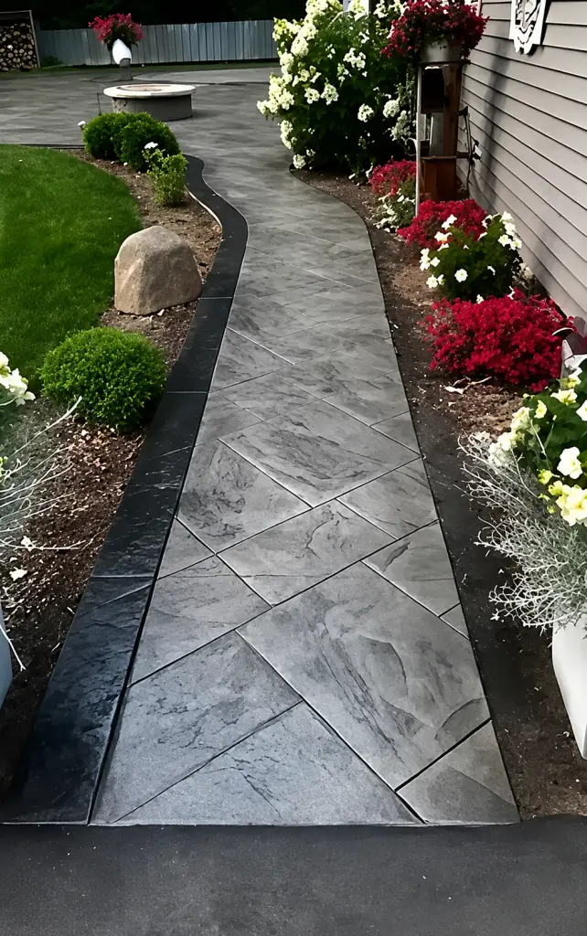 Stamped Concrete Pathway with Landscaping and Flower Beds